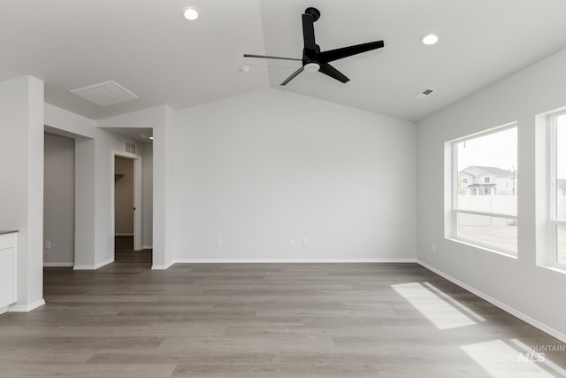 5754 W Stavros St, Meridian, ID 83646 - empty room featuring ceiling fan, recessed lighting, light wood-style floors, lofted ceiling, and baseboards