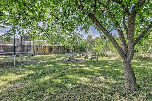 1035 N 7th Ave N, Payette, ID 83661 - view of yard featuring a trampoline and an outdoor fire pit