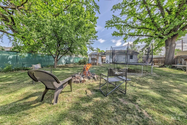 1035 N 7th Ave N, Payette, ID 83661 - view of yard featuring a trampoline and a fire pit