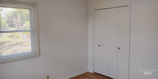 1035 N 7th Ave N, Payette, ID 83661 - unfurnished bedroom featuring a closet and wood finished floors