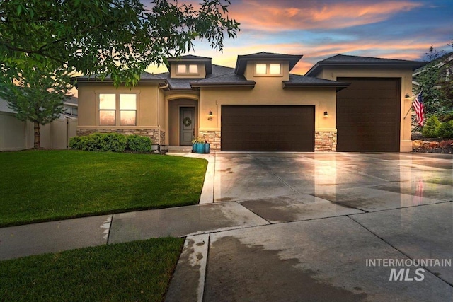 prairie-style home with a yard