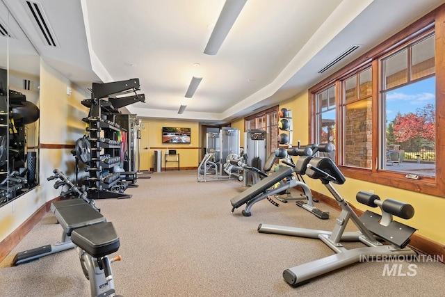 gym with baseboards and visible vents