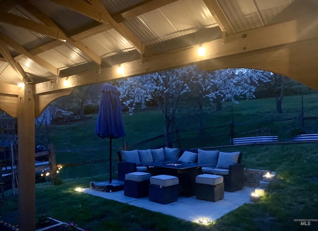 view of patio / terrace featuring an outdoor living space with a fire pit