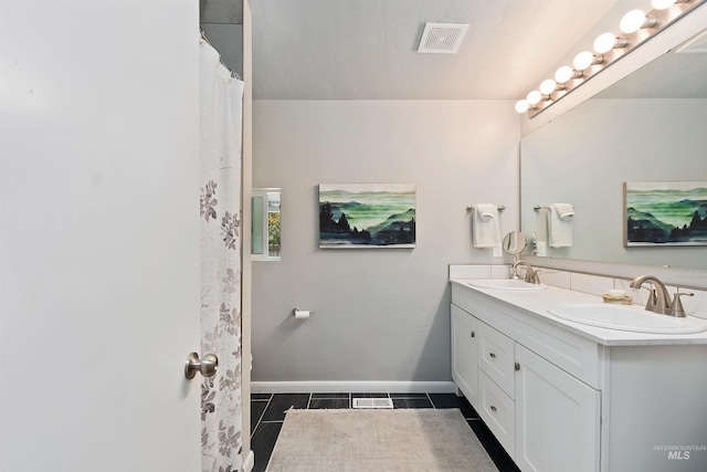 bathroom featuring vanity and tile patterned flooring