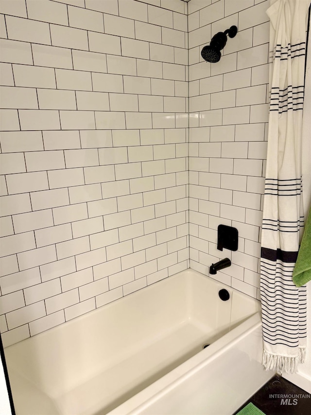 bathroom with shower / bath combination with curtain