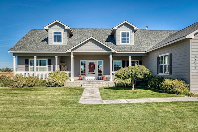 view of front facade with a front lawn and covered porch