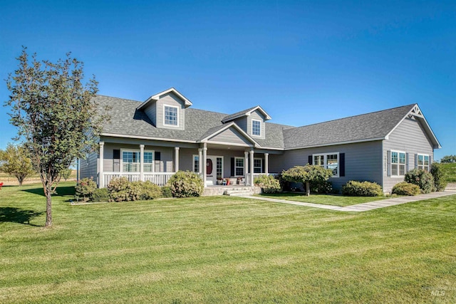 27652 Hop Rd, Caldwell, ID 83607 - new england style home with a porch, a front lawn, and roof with shingles