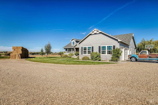 view of front of home featuring a garage and a front lawn