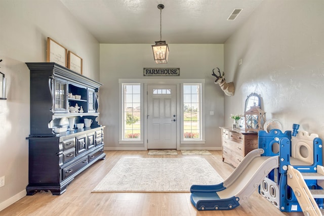 27652 Hop Rd, Caldwell, ID 83607 - entryway featuring visible vents, baseboards, and wood finished floors