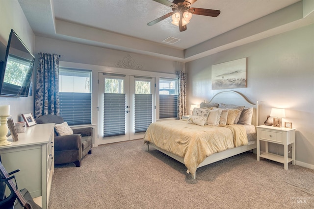 27652 Hop Rd, Caldwell, ID 83607 - bedroom featuring visible vents, multiple windows, access to outside, and light carpet