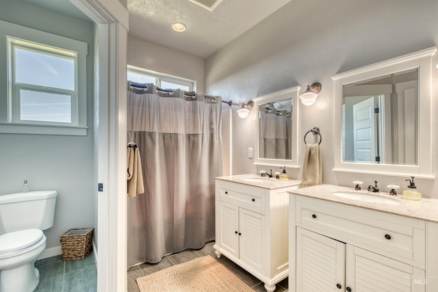 27652 Hop Rd, Caldwell, ID 83607 - bathroom with vanity, toilet, and a shower with shower curtain