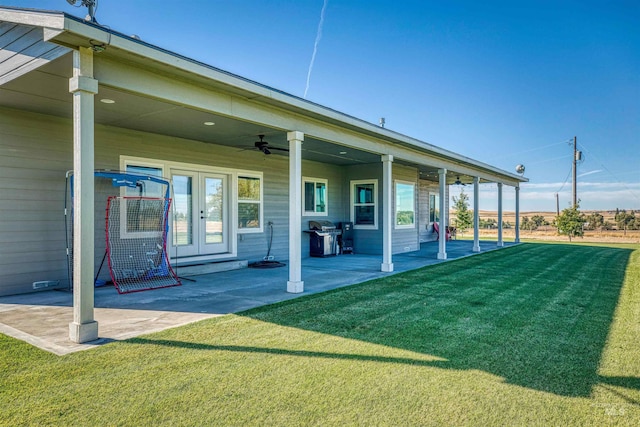 27652 Hop Rd, Caldwell, ID 83607 - rear view of property with a lawn, a patio, ceiling fan, and french doors