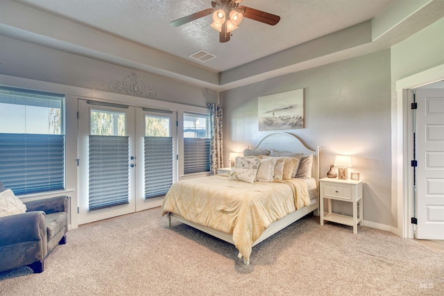 bedroom featuring ceiling fan, carpet floors, french doors, and access to exterior