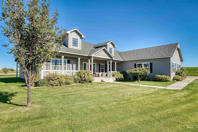 27652 Hop Rd, Caldwell, ID 83607 - cape cod house with a porch, a shingled roof, and a front yard