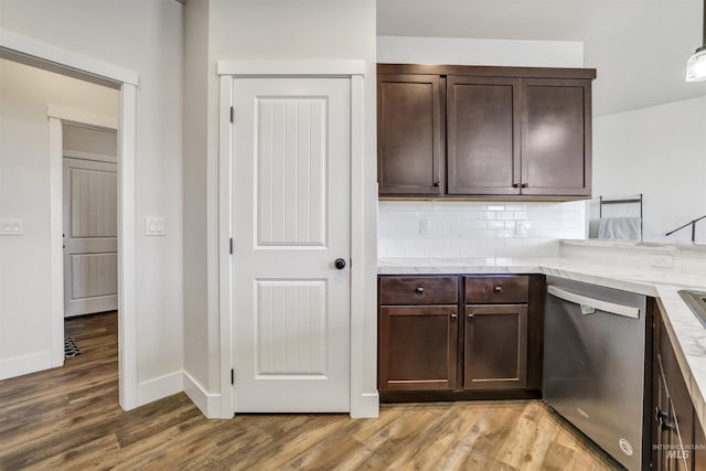 kitchen with tasteful backsplash, dark brown cabinetry, baseboards, light wood-style flooring, and dishwasher