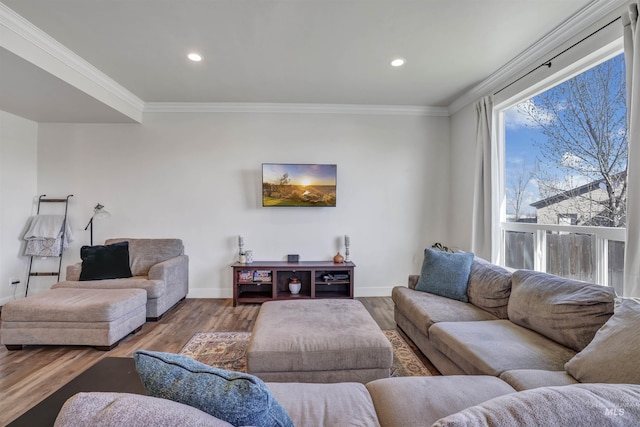living room with crown molding, baseboards, recessed lighting, and wood finished floors