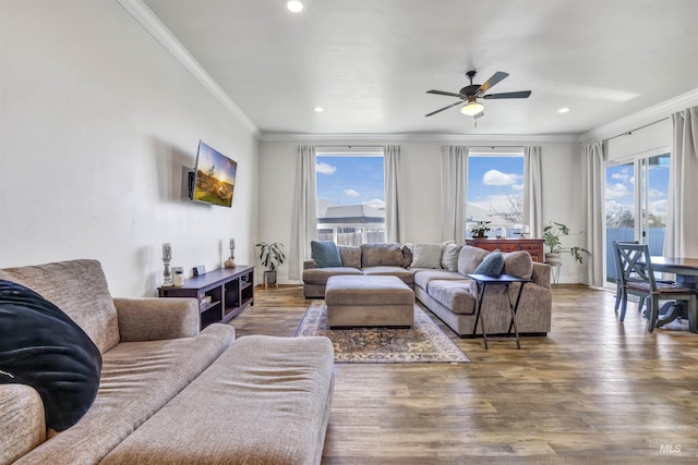 living area featuring crown molding, recessed lighting, a ceiling fan, and wood finished floors