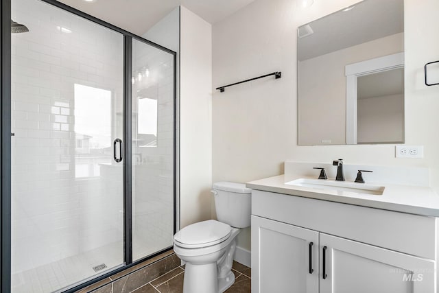 full bathroom with toilet, a stall shower, tile patterned flooring, and vanity