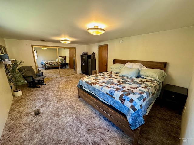 bedroom featuring carpet and a closet