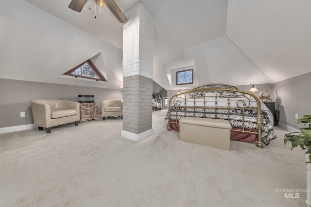 carpeted bedroom with decorative columns, high vaulted ceiling, and ceiling fan