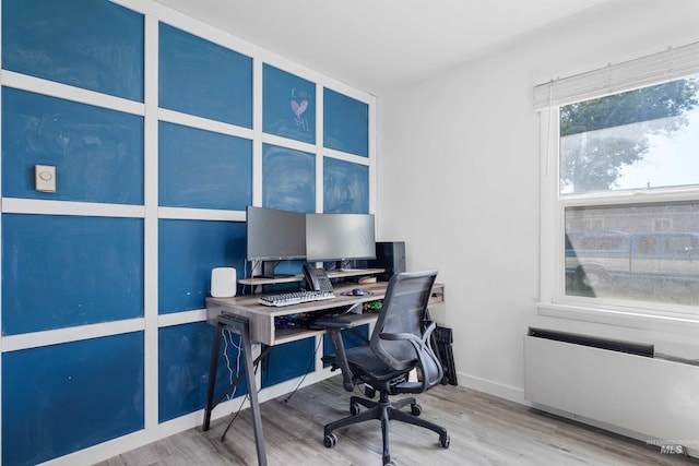 home office with wood finished floors and baseboards