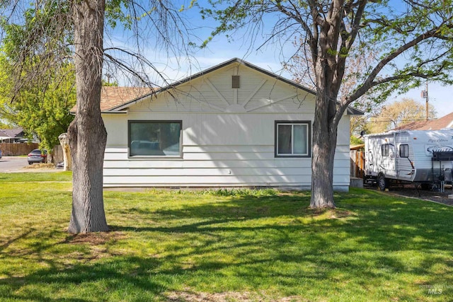 view of property exterior featuring a lawn
