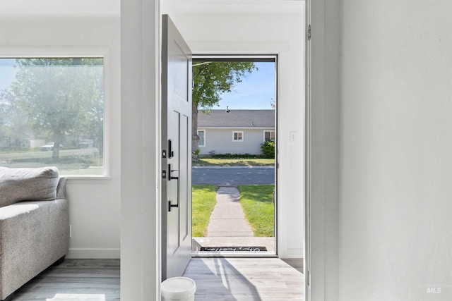 entrance foyer with wood finished floors and baseboards