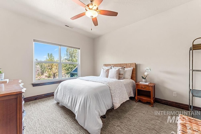 carpeted bedroom with baseboards and ceiling fan