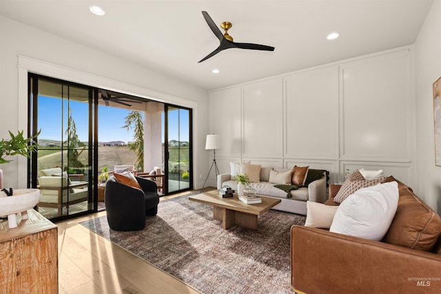 11473 N 17th Way, Boise, ID 83714 - living room featuring a decorative wall, a ceiling fan, light wood-type flooring, and recessed lighting