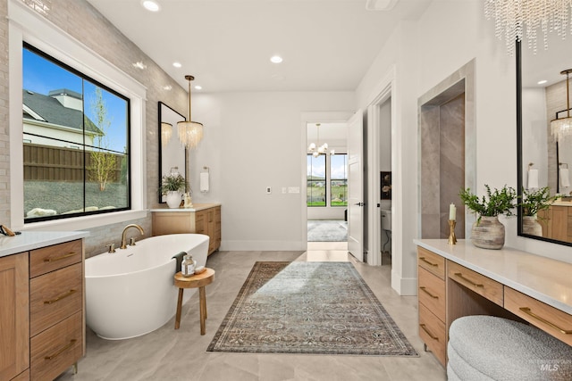11473 N 17th Way, Boise, ID 83714 - full bath featuring a freestanding bath, vanity, a chandelier, recessed lighting, and toilet