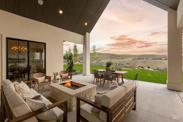 11473 N 17th Way, Boise, ID 83714 - view of patio / terrace with an outdoor living space with a fire pit, outdoor dining space, and a mountain view