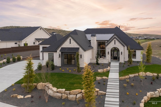 11473 N 17th Way, Boise, ID 83714 - french country style house with stone siding, roof with shingles, and driveway