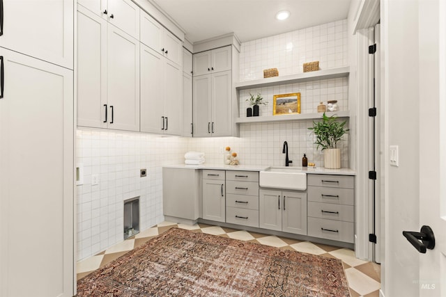 11473 N 17th Way, Boise, ID 83714 - kitchen featuring a sink, gray cabinetry, light flooring, decorative backsplash, and open shelves