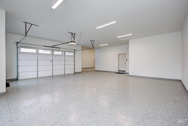 11473 N 17th Way, Boise, ID 83714 - garage featuring a garage door opener and baseboards
