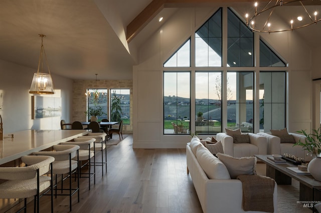 11473 N 17th Way, Boise, ID 83714 - living area with a chandelier, high vaulted ceiling, and wood finished floors