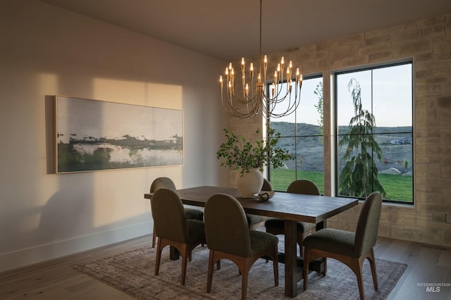 11473 N 17th Way, Boise, ID 83714 - dining room featuring baseboards, wood finished floors, and a chandelier