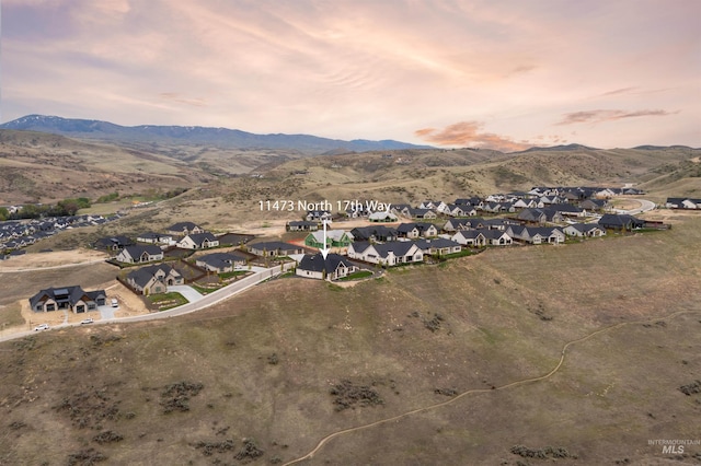 11473 N 17th Way, Boise, ID 83714 - aerial view at dusk of a residential view and a mountain view
