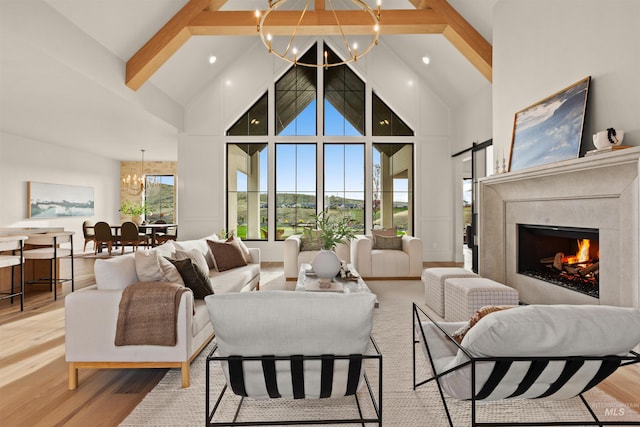11473 N 17th Way, Boise, ID 83714 - living area with a chandelier, high vaulted ceiling, beam ceiling, light wood-type flooring, and a fireplace
