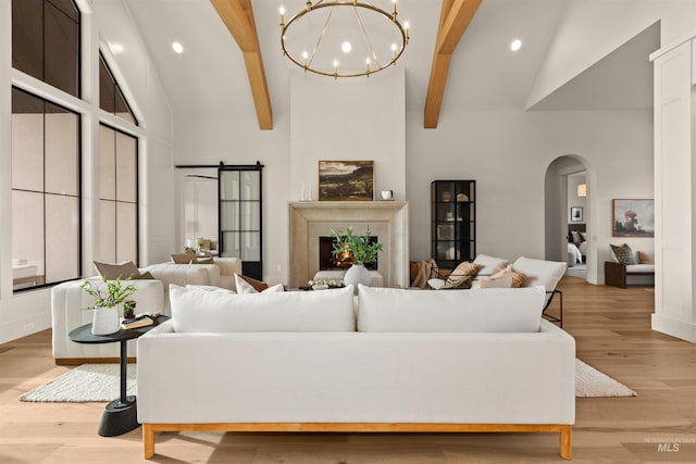 11473 N 17th Way, Boise, ID 83714 - living room with arched walkways, beamed ceiling, light wood-style floors, recessed lighting, and high vaulted ceiling