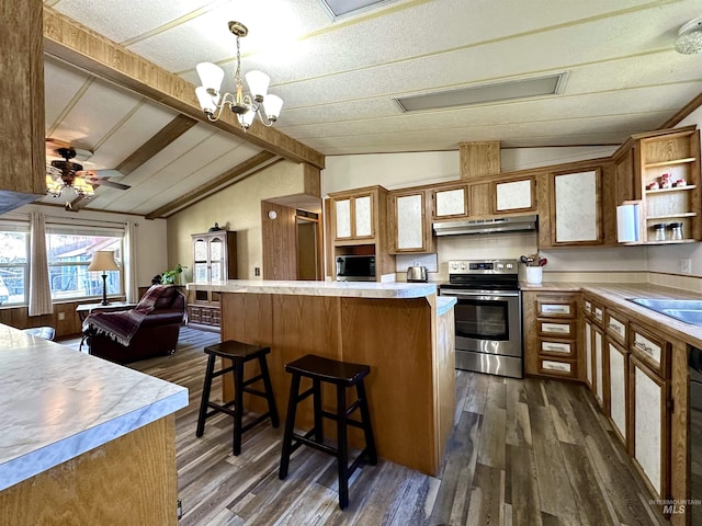 kitchen with stainless steel appliances, lofted ceiling with beams, decorative light fixtures, dark hardwood / wood-style floors, and a breakfast bar area