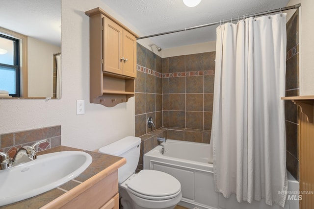 full bathroom featuring shower / bath combo, vanity, toilet, and a textured ceiling