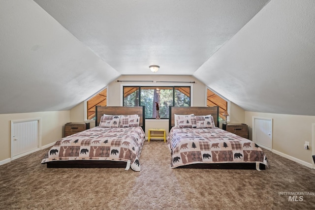 bedroom featuring carpet flooring, lofted ceiling, baseboards, and a textured ceiling