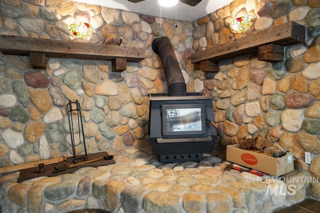detailed view of ceiling fan and a wood stove