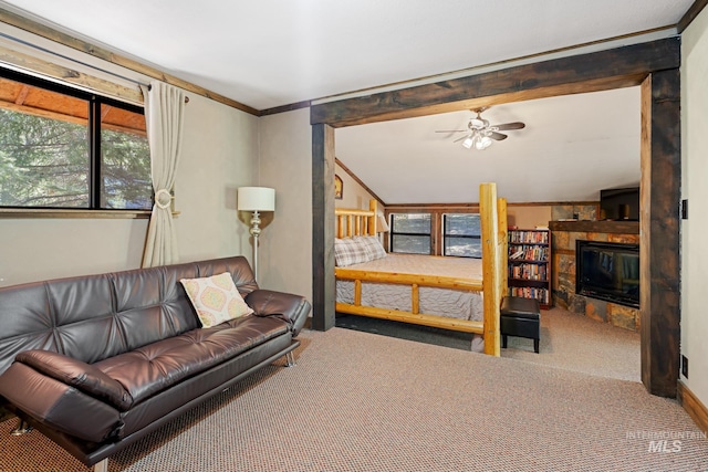 carpeted bedroom featuring a fireplace and crown molding