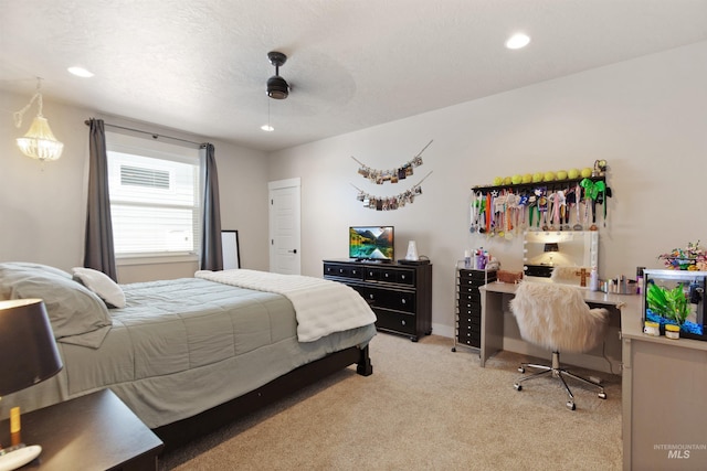 bedroom with recessed lighting, light colored carpet, ceiling fan, and a textured ceiling