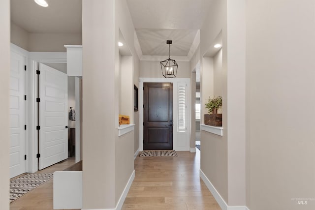 entryway with recessed lighting, light wood-style flooring, and baseboards