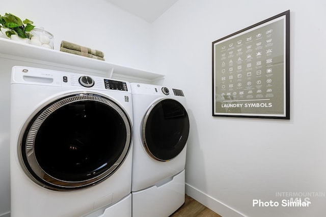 5543 E Bridal Veil Falls Dr, Nampa, ID 83686 - laundry area with separate washer and dryer, baseboards, and wood finished floors
