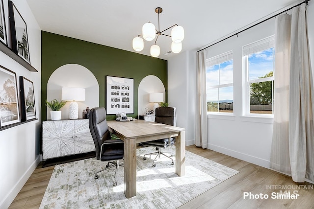 5543 E Bridal Veil Falls Dr, Nampa, ID 83686 - office space featuring a chandelier, wood finished floors, and baseboards