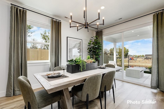 5543 E Bridal Veil Falls Dr, Nampa, ID 83686 - dining room featuring a chandelier, light wood-type flooring, and recessed lighting