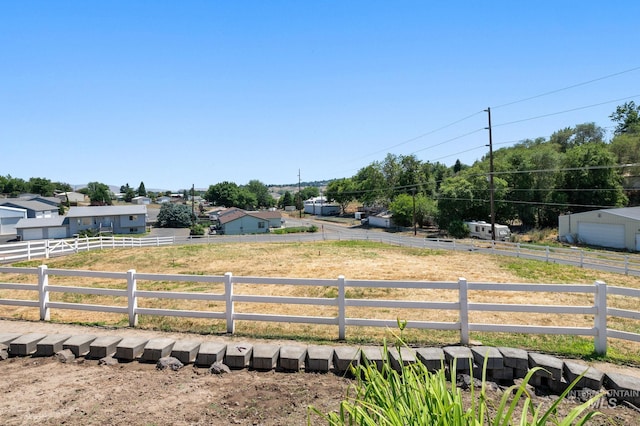 view of yard with a rural view